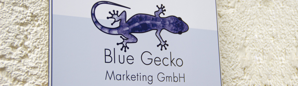 Blue Gecko Marketing – The technology marketing agency's sign on the side of the building.